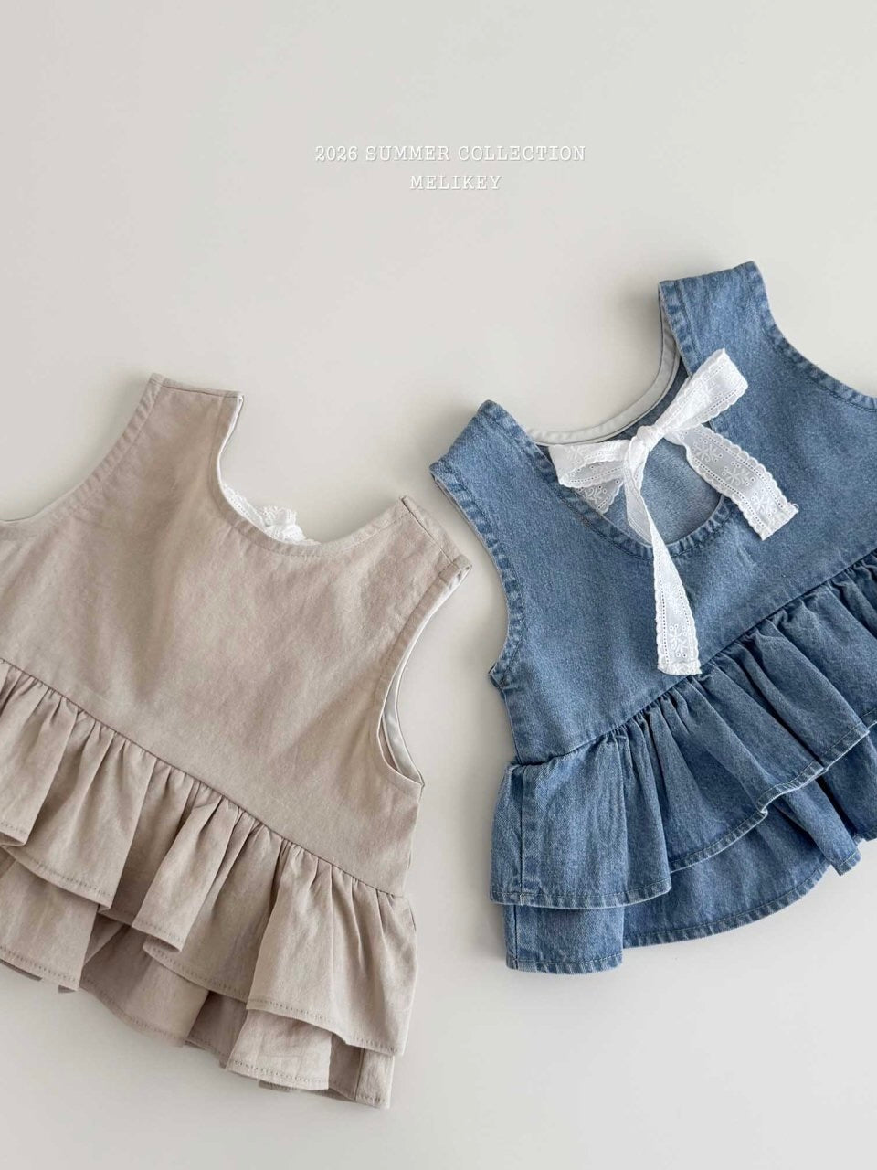 Ribbon tiered sleeveless blouse