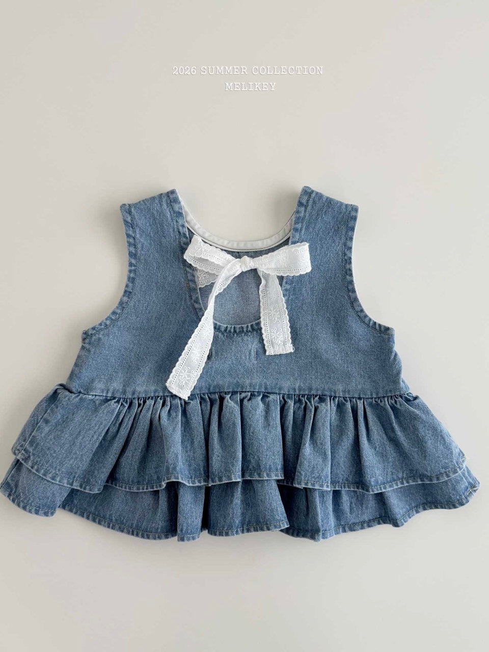 Ribbon tiered sleeveless blouse