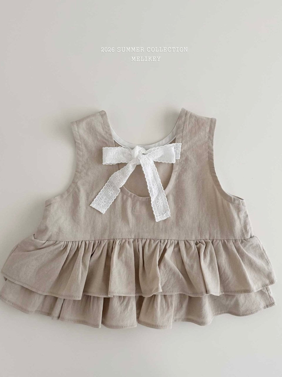 Ribbon tiered sleeveless blouse