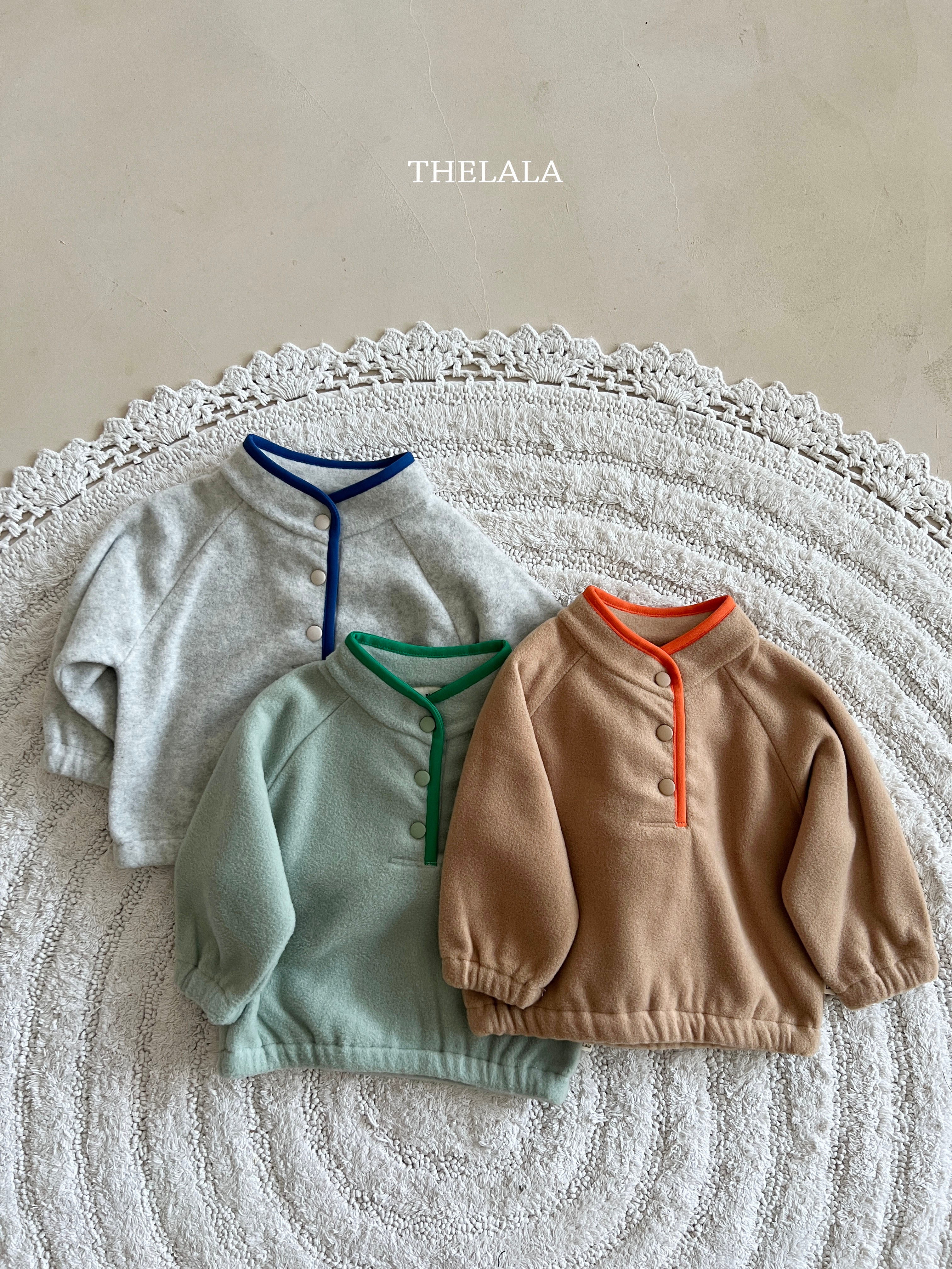 Three-button sweater