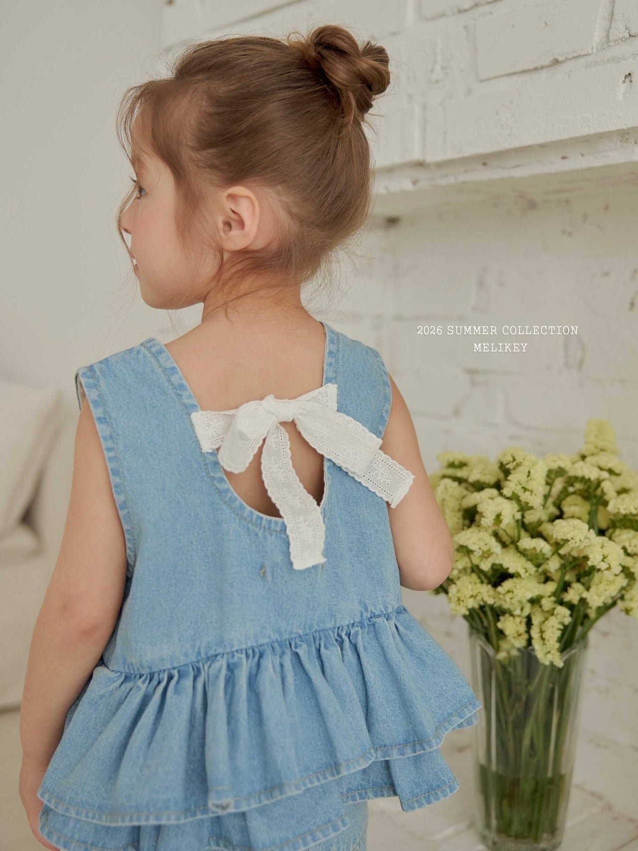 Ribbon tiered sleeveless blouse