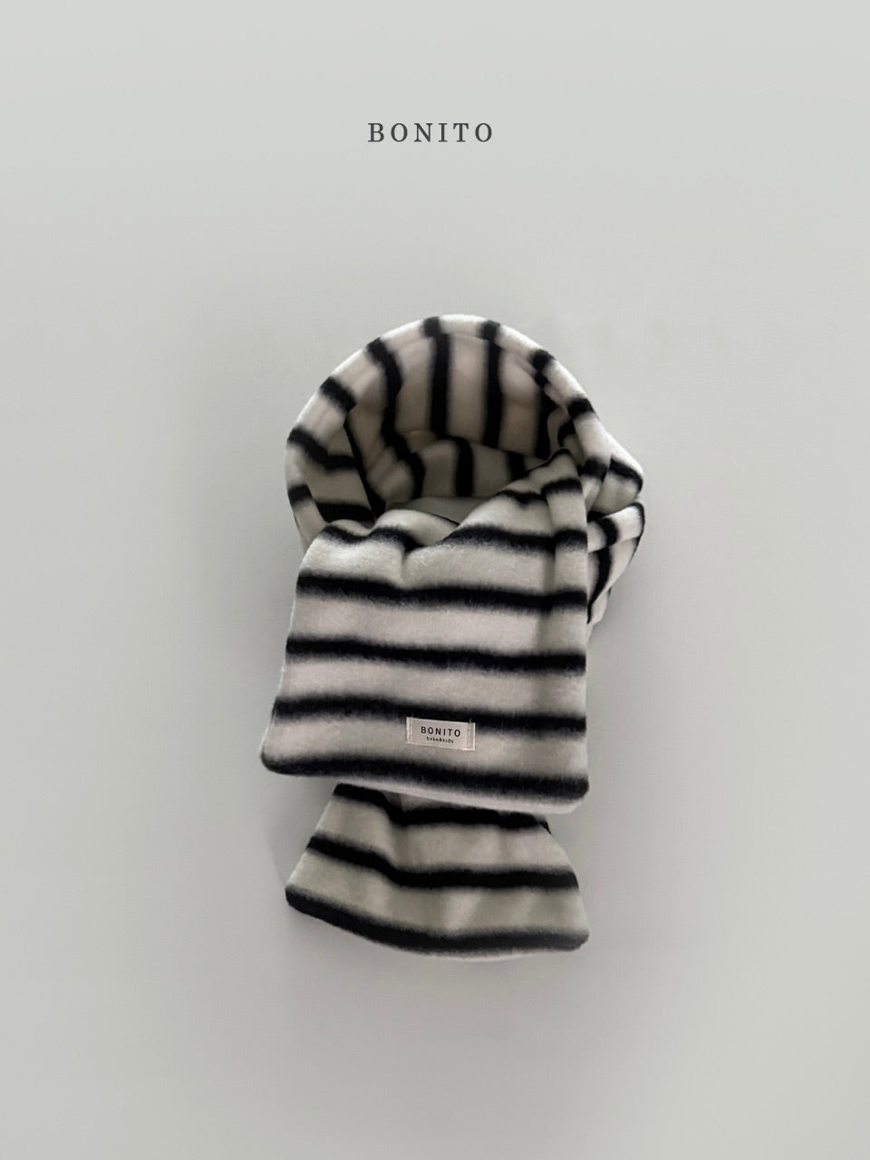 Point stripe muffler