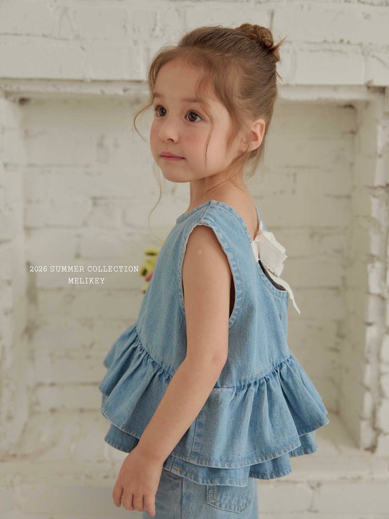 Ribbon tiered sleeveless blouse