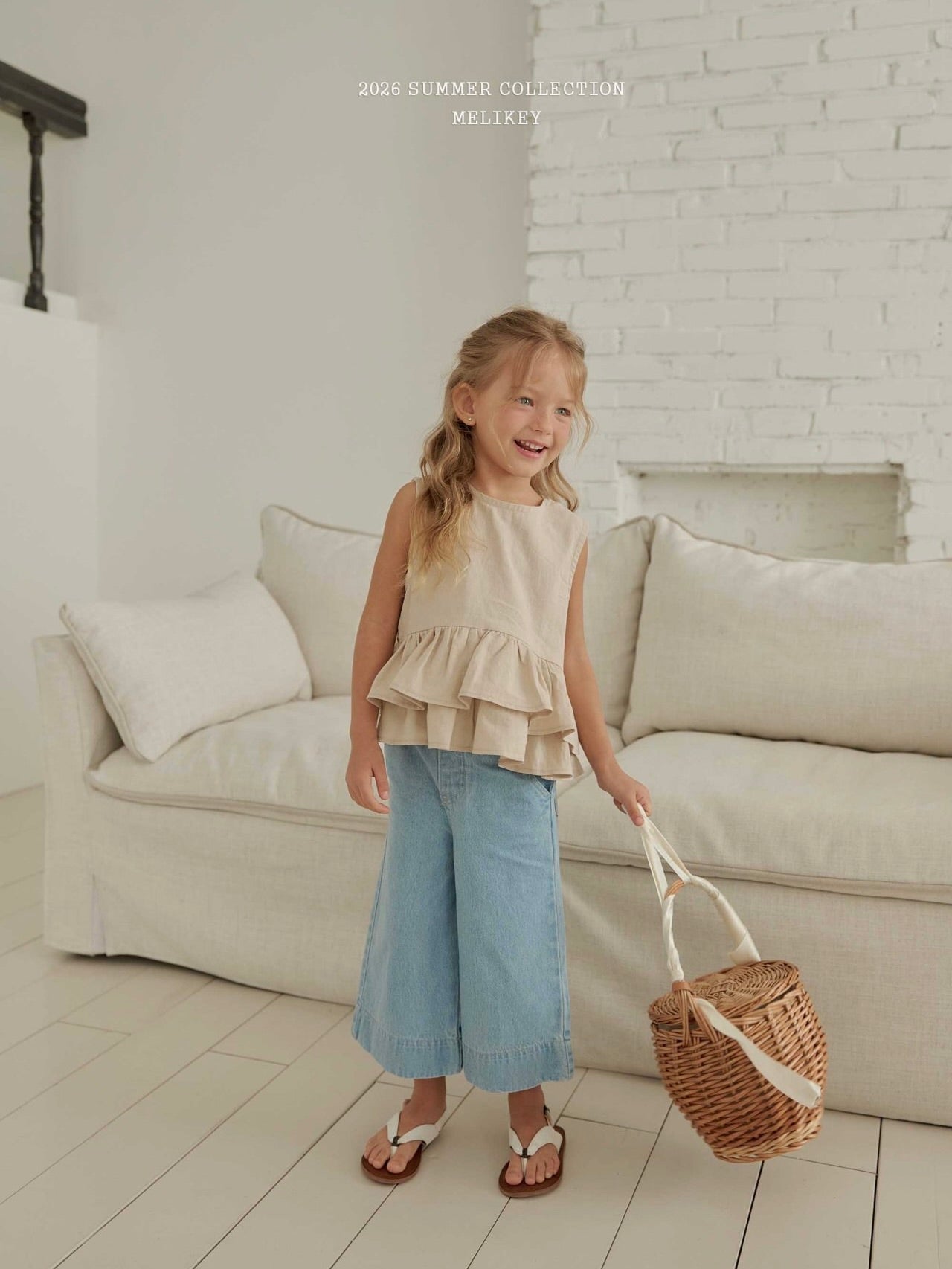 Ribbon tiered sleeveless blouse