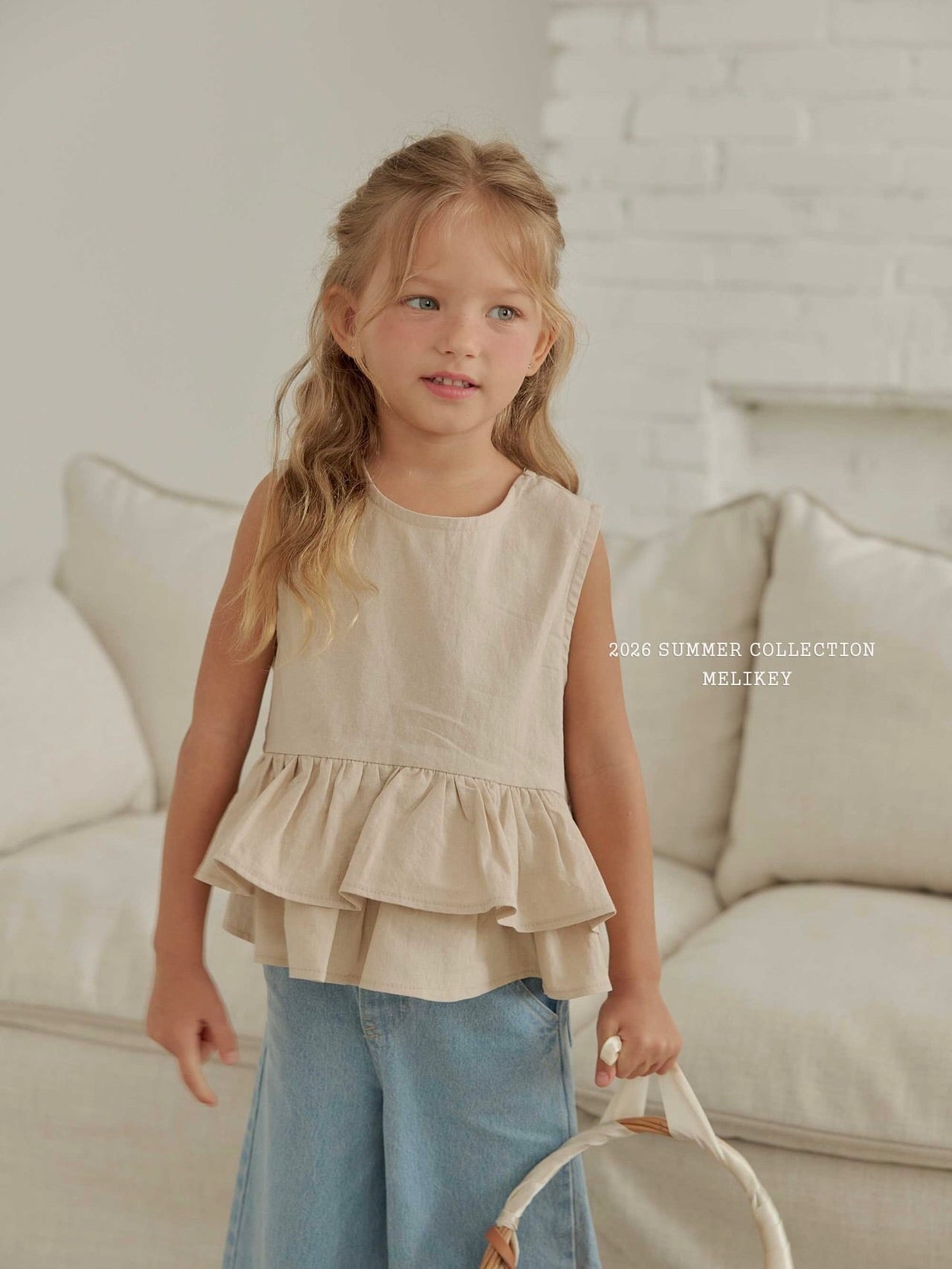 Ribbon tiered sleeveless blouse