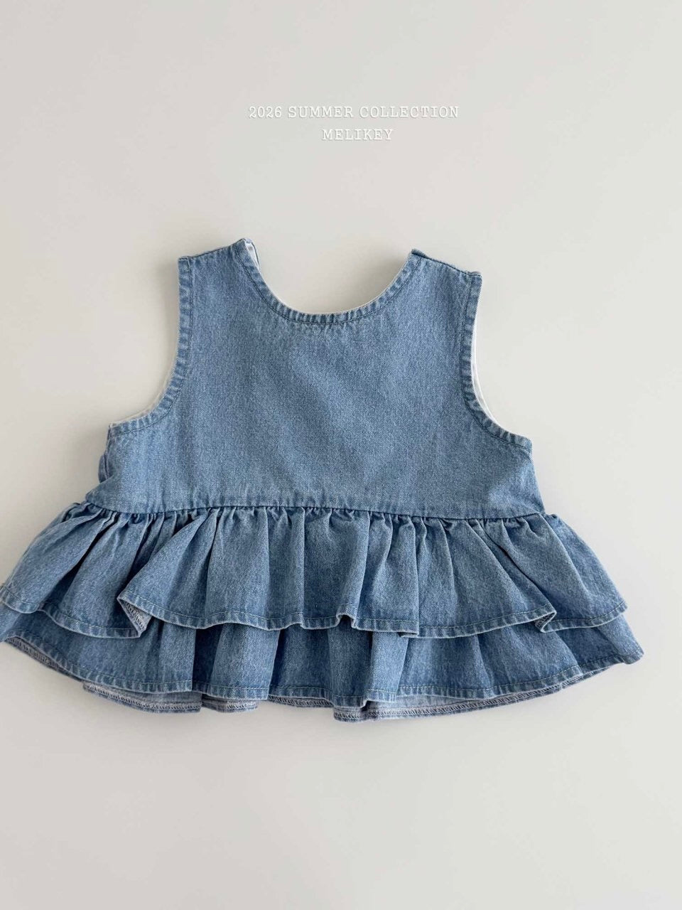 Ribbon tiered sleeveless blouse