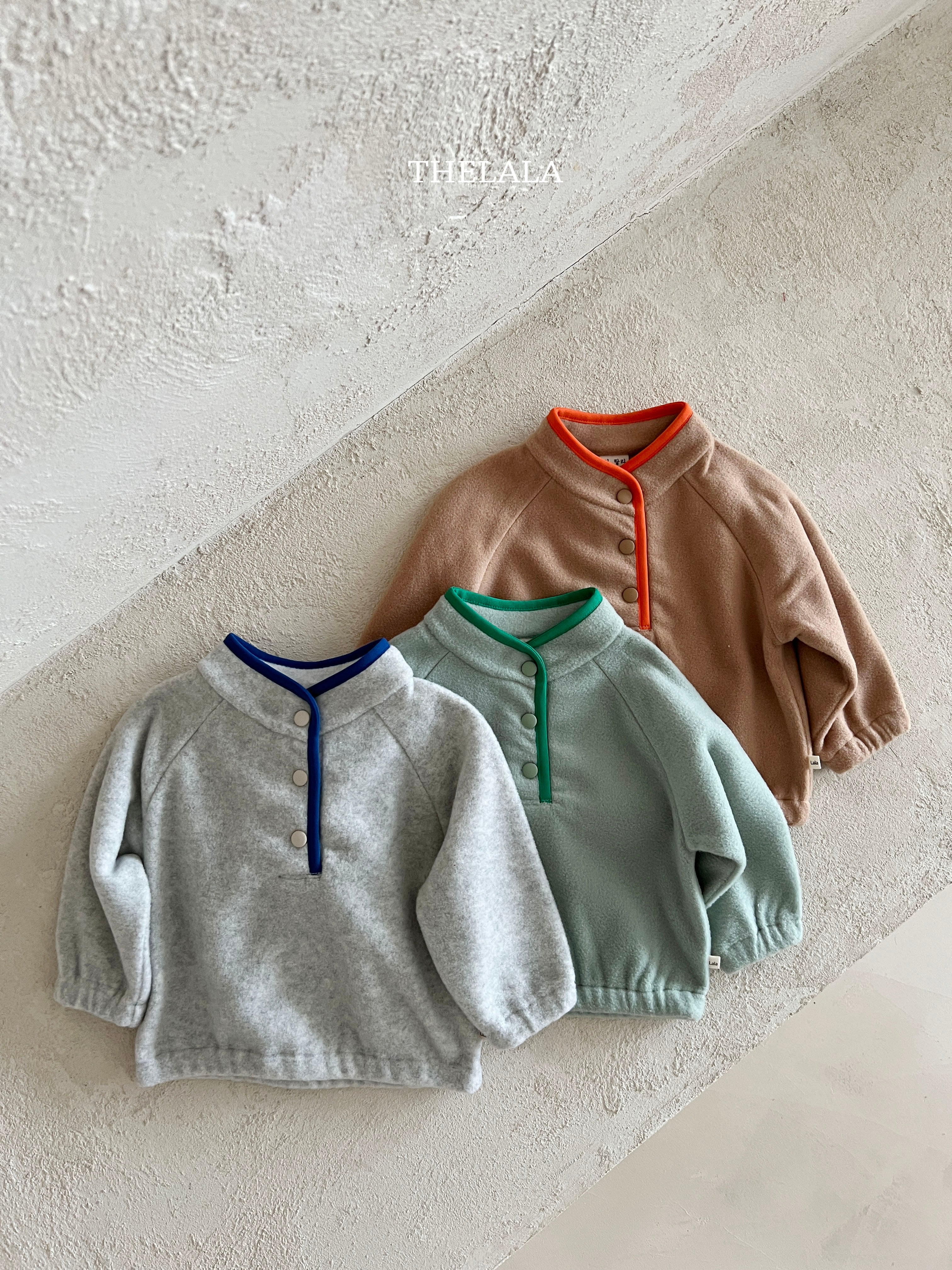 Three-button sweater